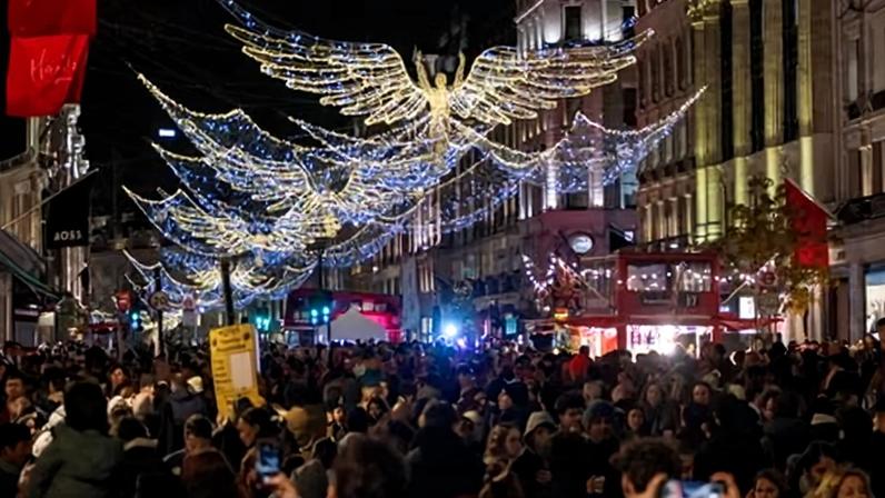 Christmas shoppers and tourists throng a traffic-free Oxford Street in London on Saturday. Photograph: Krisztián Elek/SOPA Images/Shutterstock