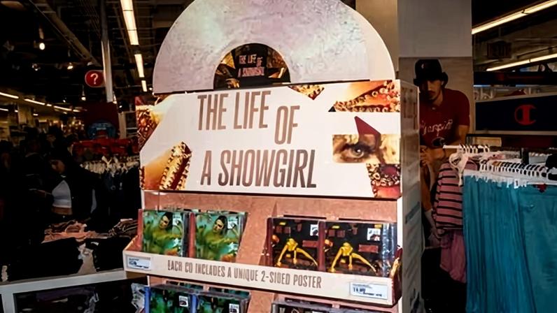 Copies of US singer Taylor Swift's album The Life of a Showgirl are seen on a stand during the release party at Target in Times Square, in New York