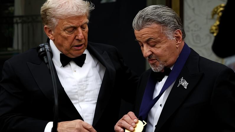 Sylvester Stallone receives a medal from Donald Trump in the Oval Office, in Washington DC on 6 December.