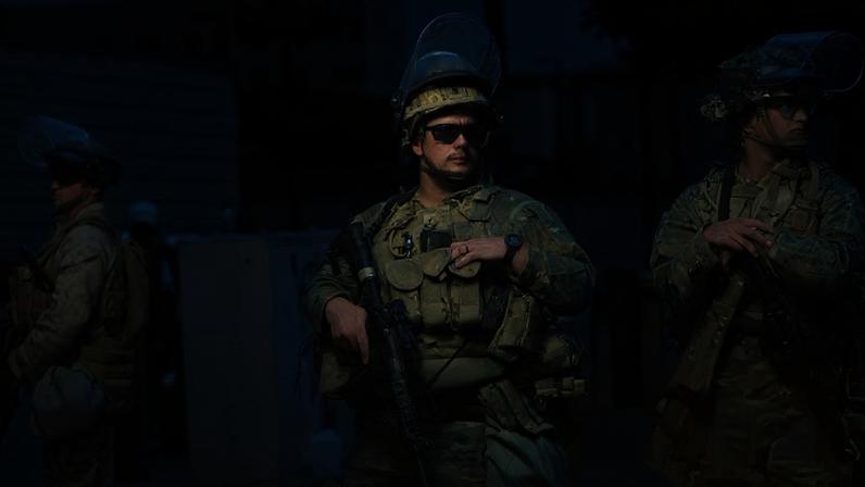 Members of the California national guard and US marines guard a federal building in Los Angeles on 17 June 2025. Photograph: Damian Dovarganes/AP
