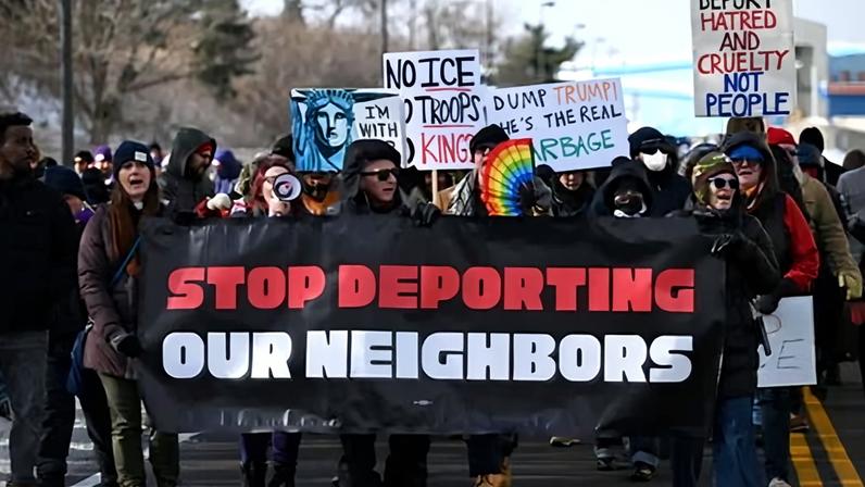 People protest against the Trump administration in Minneapolis, Minnesota, on 3 December 2025.
