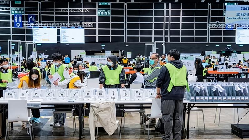 Election officials start to count the ballots on Monday after polls closed in the Legislative Council elections in Hong Kong.