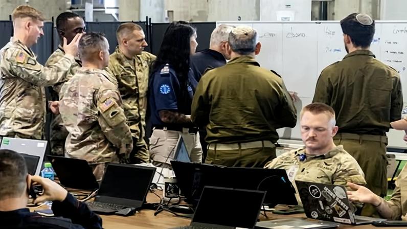 US army personnel, IDF personnel and other international officials meeting during a media tour inside the CMCC in Kiryat Gat, Israel, 20 November 2025.