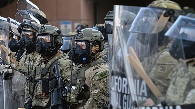 Members of the California national guard and police officers in Los Angeles on 12 June 2025.