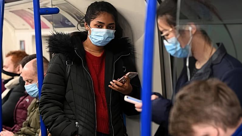 Commuters on a London Underground train during the Covid pandemic in November 2021.