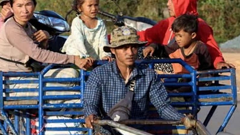 Cambodian civilians flee their homes near the border with Thailand for a safe shelter in Siem Reap province, Cambodia on Monday.
