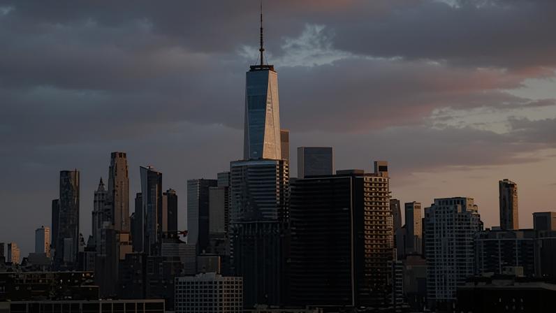 The sun sets on the skyline of lower Manhattan and One World Trade Center in New York City. Photograph: Gary Hershorn/Getty Images