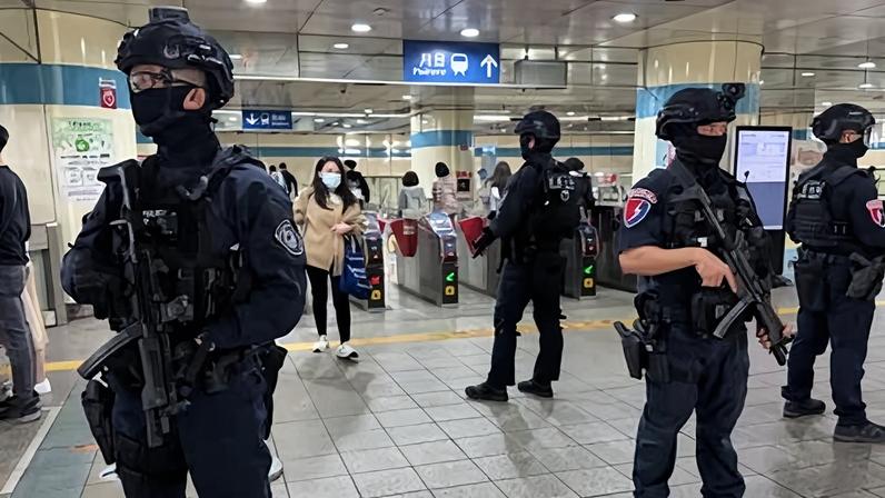Armed police in a metro station after the attack.