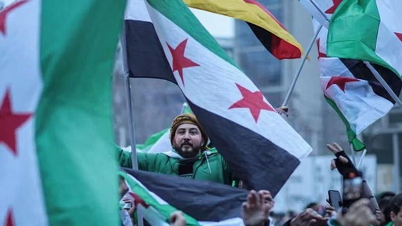 Syrians in Berlin celebrate the fall of the Assad regime on 8 December 2024.