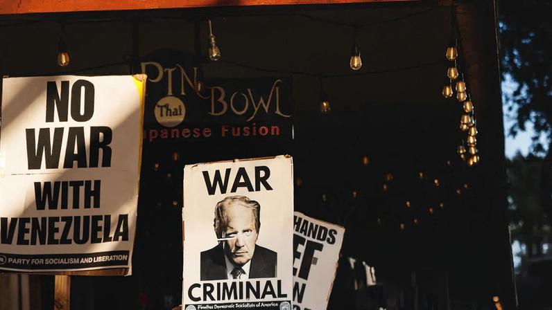 People protest against the US military's deployment and targeting of suspected drug trafficking boats in the Caribbean, in St Petersburg, Florida, 16 November 2025.