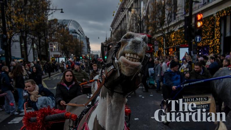 Early morning preparation in Wapping for the London Christmas drive through central London. Photograph: Jill Mead/The Guardian