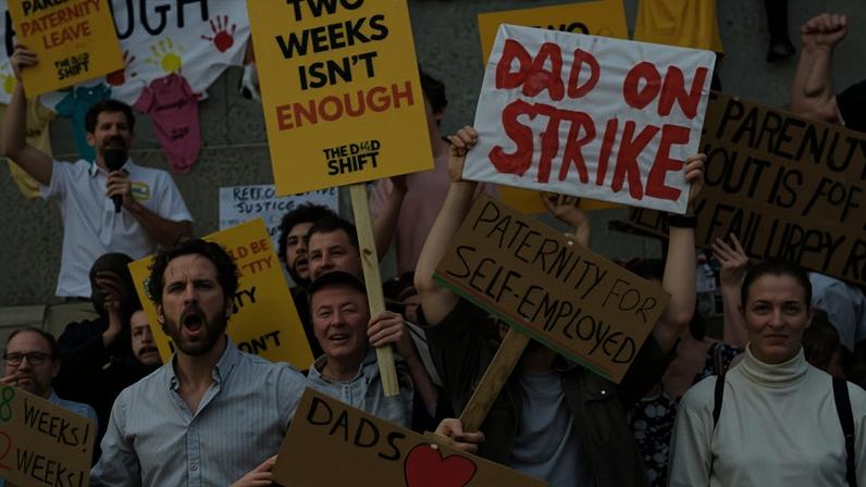 Men gathered in June at a ‘Dad strike’ to protest against the lack of paternity leave in the UK.