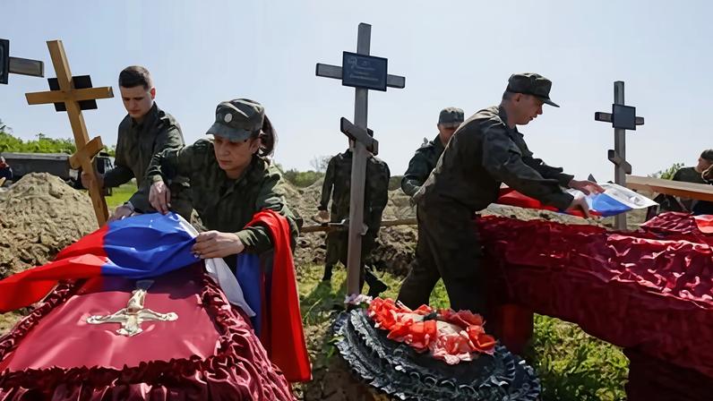 Russian soldiers are buried in Luhansk, Ukraine, in May 2023. Photograph: Alexander Ermochenko/Reuters