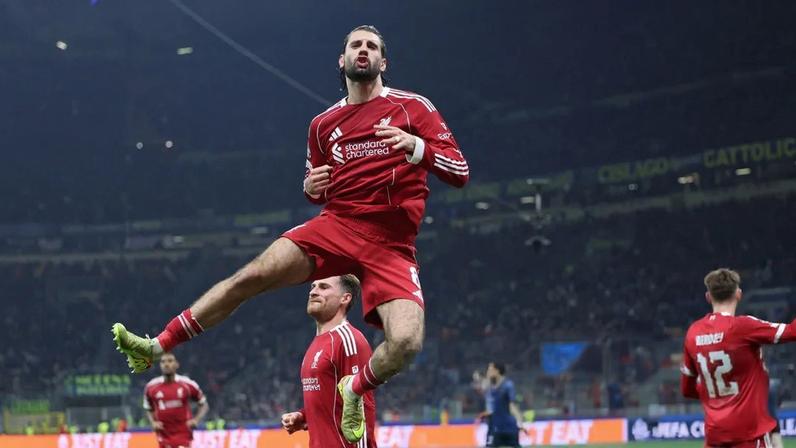 Dominik Szoboszlai scores a late penalty as Liverpool lead in Milan