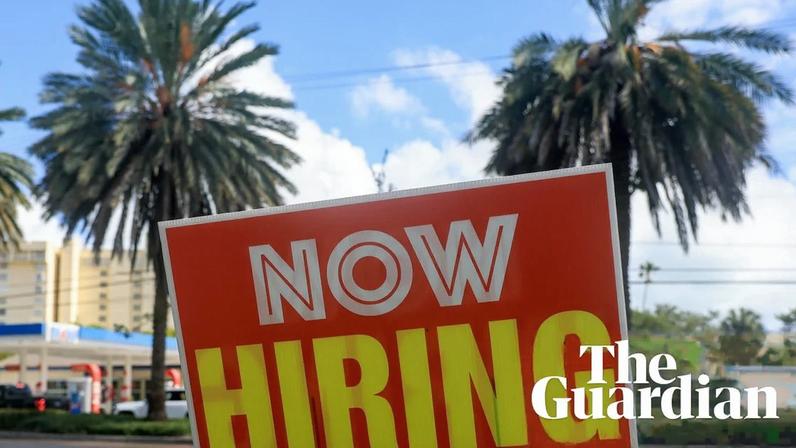 A 'Now Hiring' sign in Miami, Florida, on 3 October. Photograph: Joe Raedle/Getty Images