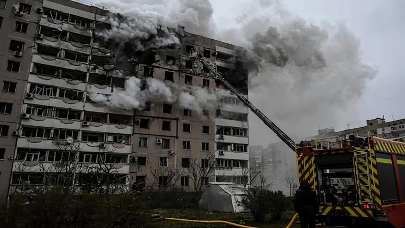 Firefighters battle a blaze in an apartment block hit by a Russian guided aerial bomb in Zaporizhzhia, southern Ukraine.