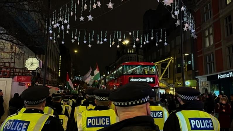 Met officers at a pro-Palestine march in Oxford Street, London, on Tuesday. Lawyers have suggested the force is overstepping its legal powers in relation to some protests.