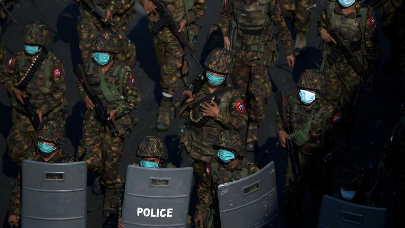 Myanmar soldiers from the 77th light infantry division walk along a street during a protest against the military coup in Yangon, Myanmar, February 28, 2021. Picture taken February 28, 2021. REUTERS/Stringer/File Photo