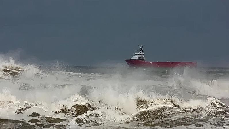 Getty Images A stock image of a ship in stormy seas off Aberdeen, Scotland.