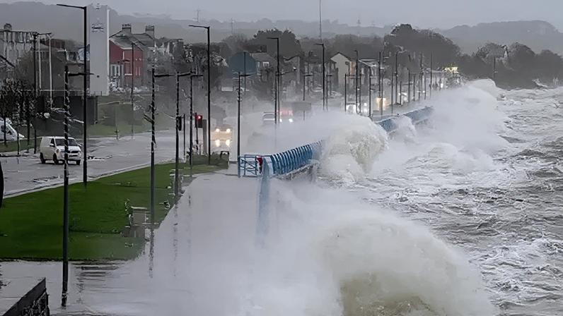 Large waves were captured crashing over the sea wall in Carrickfergus on Tuesday