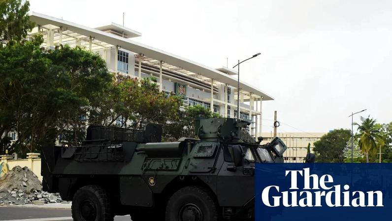 Military armoured vehicles in Cotonou, Benin, where Nigerian forces have been carrying out airstrikes.