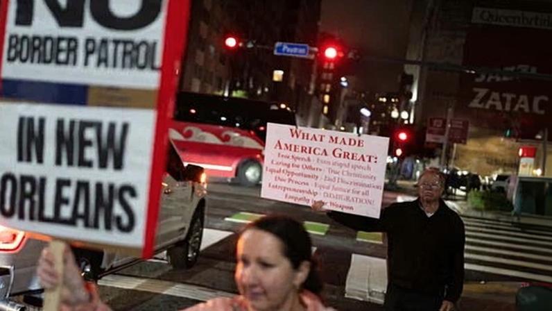 People hold signs during a protest against the US border patrol and Immigration and Customs Enforcement in New Orleans, Louisiana, on Saturday. Photograph: Adam Gray/AFP/Getty Images