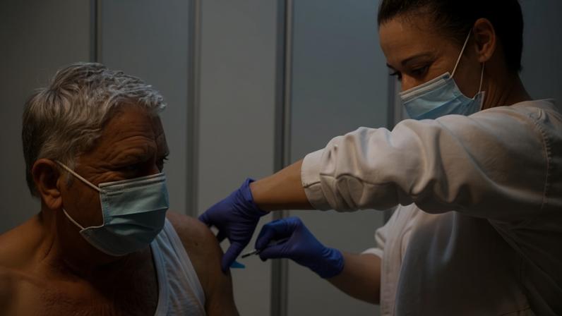 The World Health Organization has called on people to get the flu vaccine, which lowers the risk of serious illness from the new strain. Photograph: Biel Aliño/EPA