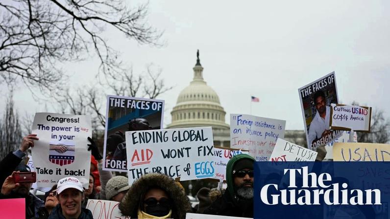 Protesters in Washington DC at a rally in support of USAID in February 2025, after cuts by the Trump administration.