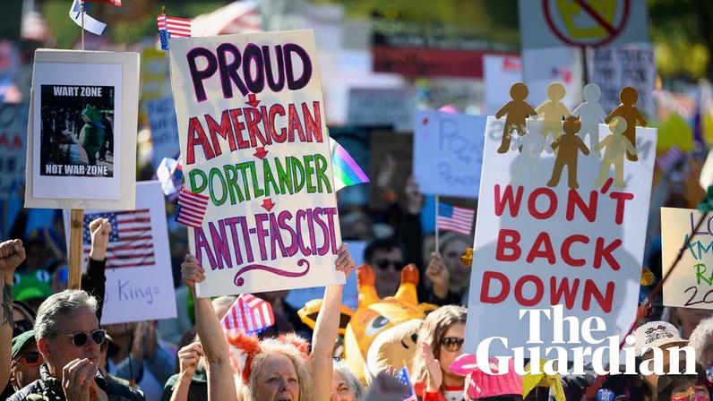 Demonstrators cheer during a speech as protesters gather to march for the ‘No Kings’ protest on 18 October 2025 in Portland, Oregon.