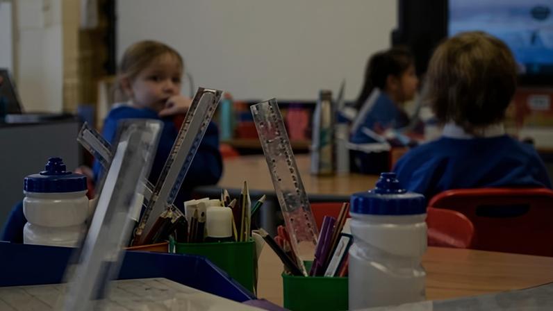 School supplies with kids in classroom. Photograph: tagphoto/Getty Images