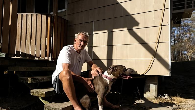 Garry Morgan at his home near Bulahdelah after it was saved from a bushfire by the NSW RFS. Photograph: Blake Sharp-Wiggins/The Guardian