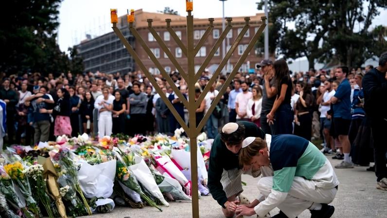 Community members gather outside of Bondi Pavilion in Sydney following a mass shooting at a Jewish Hanukkah celebration.