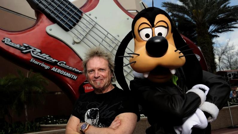 Aerosmith drummer Joey Kramer poses with Goofy Feb. 25, 2011.