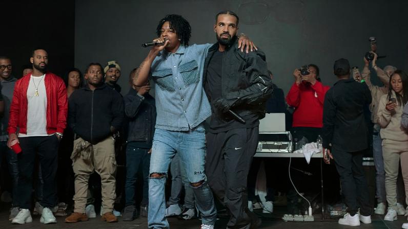 21 Savage and Drake performing together in 2022.