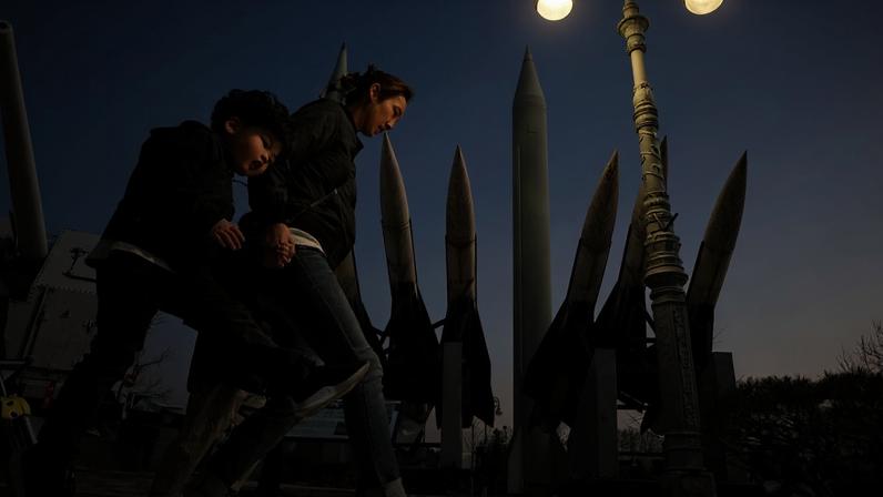 South Koreans walk past missile replicas at the Korean War Memorial on Feb. 28, 2019 in Seoul.