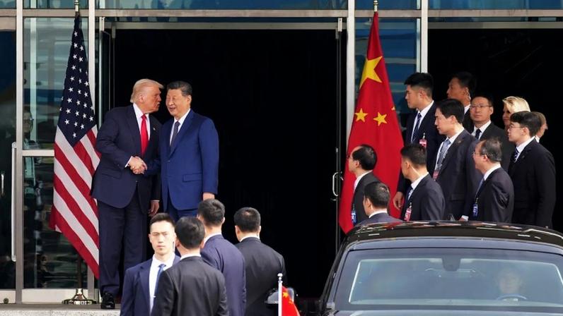 Trump and Xi shake hands.