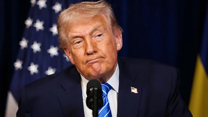 U.S. President Donald Trump listens during a press conference with Ukrainian President Volodymyr Zelensky (not pictured) in Florida.