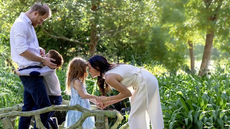 Prince Harry, Meghan Markle, Prince Archie and Princess Lilibet appeared in an adorable holiday photo Friday.