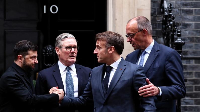 Ukrainian President Volodymyr Zelensky, British Prime Minister Keir Starmer, French President Emmanuel Macron, and German Chancellor Friedrich Merz chat at No. 10 Downing St. in London.