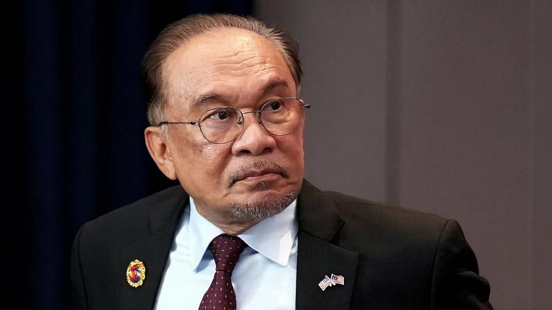 Malaysian Prime Minister Anwar Ibrahim presides over the signing of a Cambodia-Thailand peace deal at Kuala Lumpur Convention Centre in Kuala Lumpur, Malaysia, on October 26.