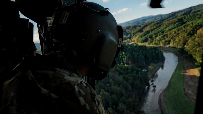 National Guard soldiers look for people in distress as they scan rural areas affected by Hurricane Helene near Ashe County, North Carolina.