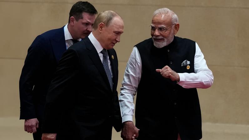 Indian Prime Minister Narendra Modi walks next to Russian President Vladimir Putin during the Shanghai Cooperation Organisation summit in Tianjin, China, on Sept. 1.