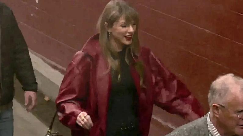 Taylor Swift in a red jacket at the Kansas City Chiefs game.