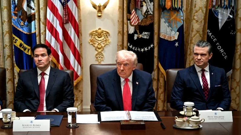 U.S. President Donald Trump, center, alongside U.S. Secretary of State Marco Rubio, left, and U.S. Secretary of Defense Pete Hegseth, right, holds a cabinet meeting at the White House in Washington.