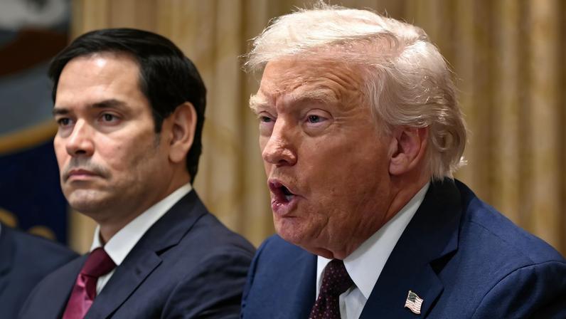 US President Donald Trump speaks as Secretary of State Marco Rubio looks on during a cabinet meeting in the Cabinet Room of the White House in Washington, DC, on August 26, 2025. (Photo by Mandel NGAN / AFP)
