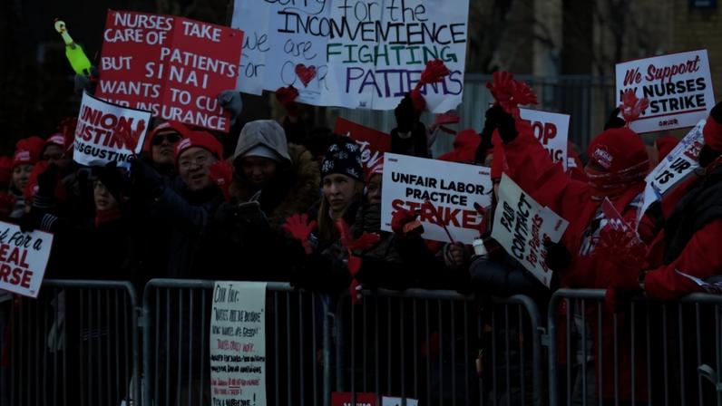 Photo by TIMOTHY A. CLARY / AFP Nurses gather as they strike outside Mount Sinai Hospital in New York on January 12, 2026. According to US media reports, nearly 15,000 nurses went on strike Monday morning after no agreement was reached ahead of the deadline for contract negotiations.