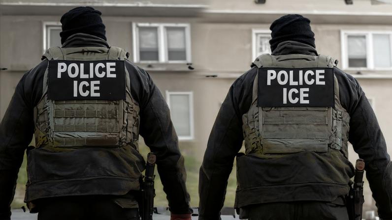 Diptych showing the backs of two ICE agents.