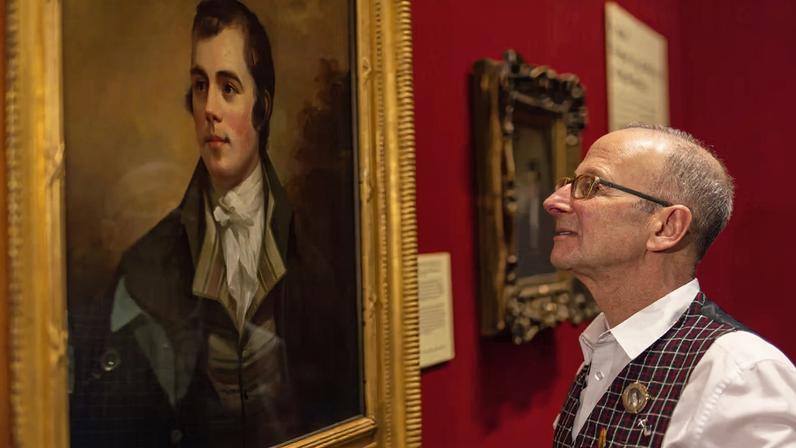 William Zachs looking at the rediscovered portrait of Robert Burns (around 1803) by Henry Raeburn