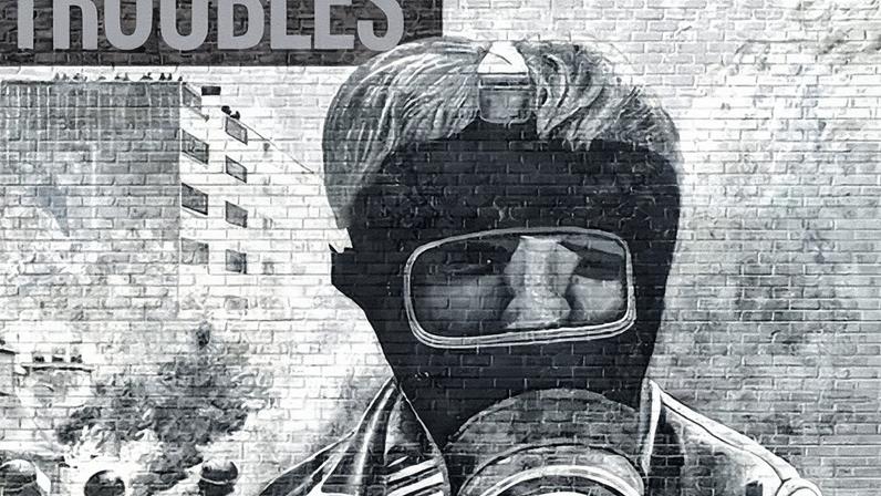 Board game cover featuring an iconic image from Derry of a boy with a petrol bomb and gas mask