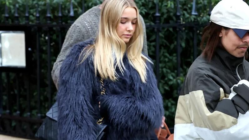 Harper Beckham stepped out in a blue fur coat and $4000 vintage Chanel purse on Tuesday.